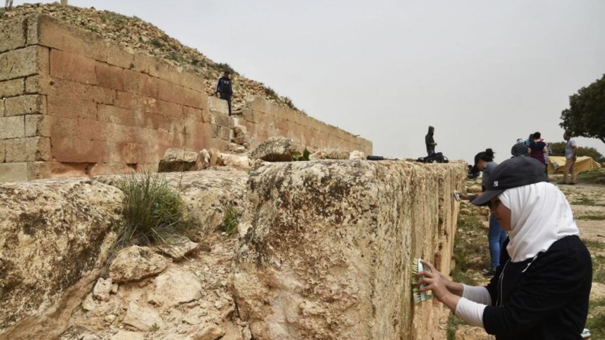Experts and students from Algiers University’s Archaeology Institute work on one of the Jeddars pyramid tombs.
RYAD KRAMDI / AFP