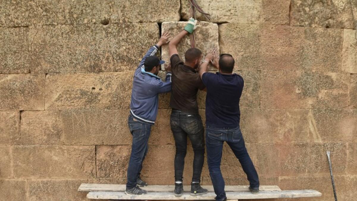 Experts and students from Algiers University’s Archaeology Institute work on one of the Jeddars pyramid tombs, near the city of Tiaret.
RYAD KRAMDI / AFP