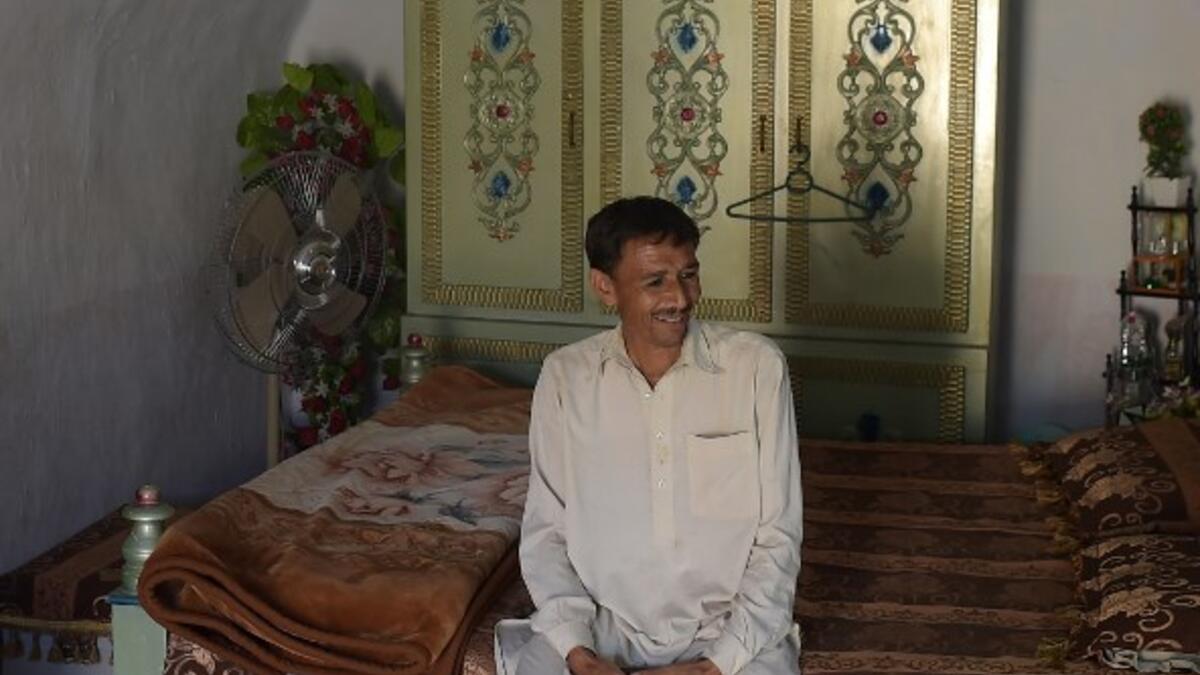 Pakistani villager Ameer Ullah Khan sits in his cave room in Nikko village, about 60 kilometres from the capital Islamabad.
AAMIR QURESHI / AFP