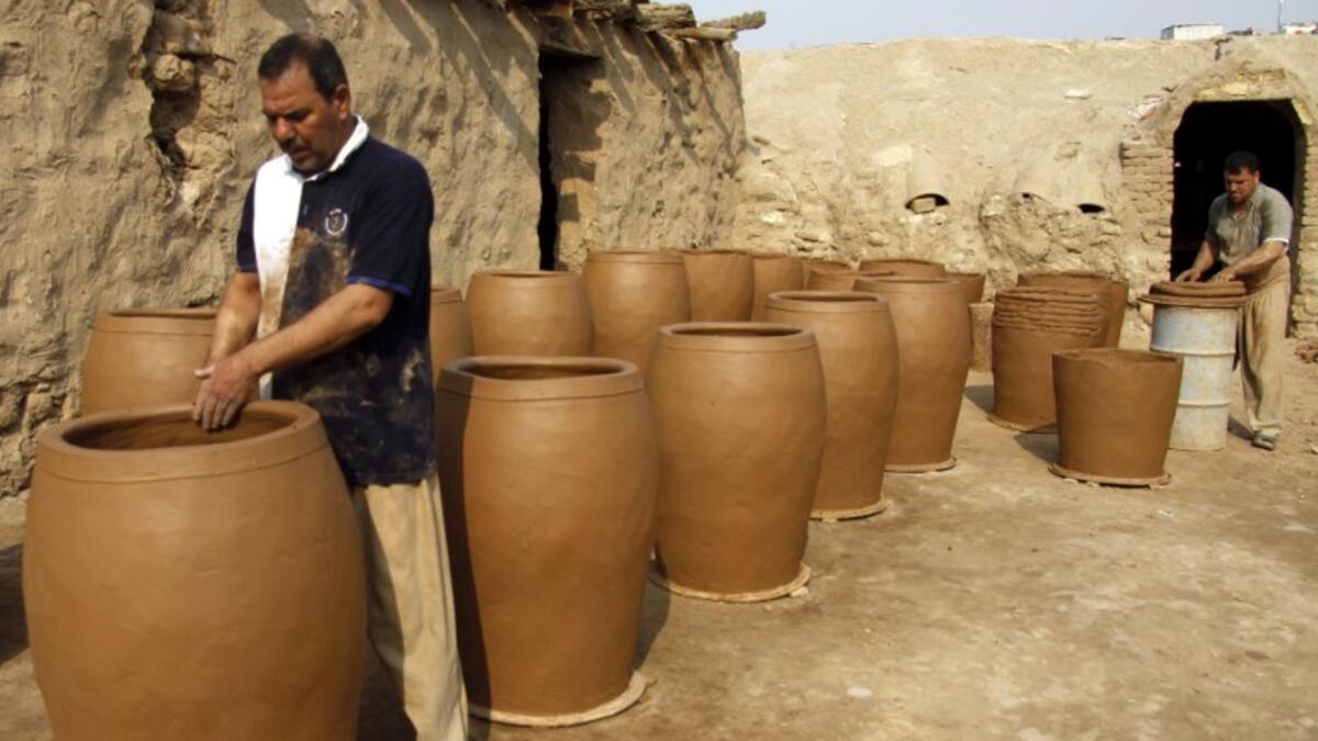 Iraqis making clay pots in Najaf on November 11, 2018. Pottery has deep roots in Iraq, where ancient civilisations turned to clay to build their homes, shape their cooking utensils, and even make their ovens.
Haidar HAMDANI / AFP