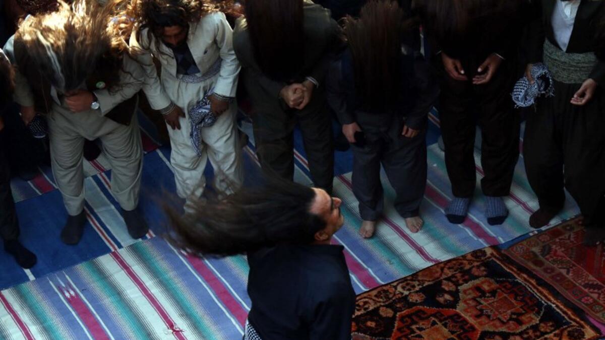 Iraqi Sufi Muslim Kurds take part in a ritual ceremony to commemorate the birth of the Prophet Mohammed.
SAFIN HAMED / AFP