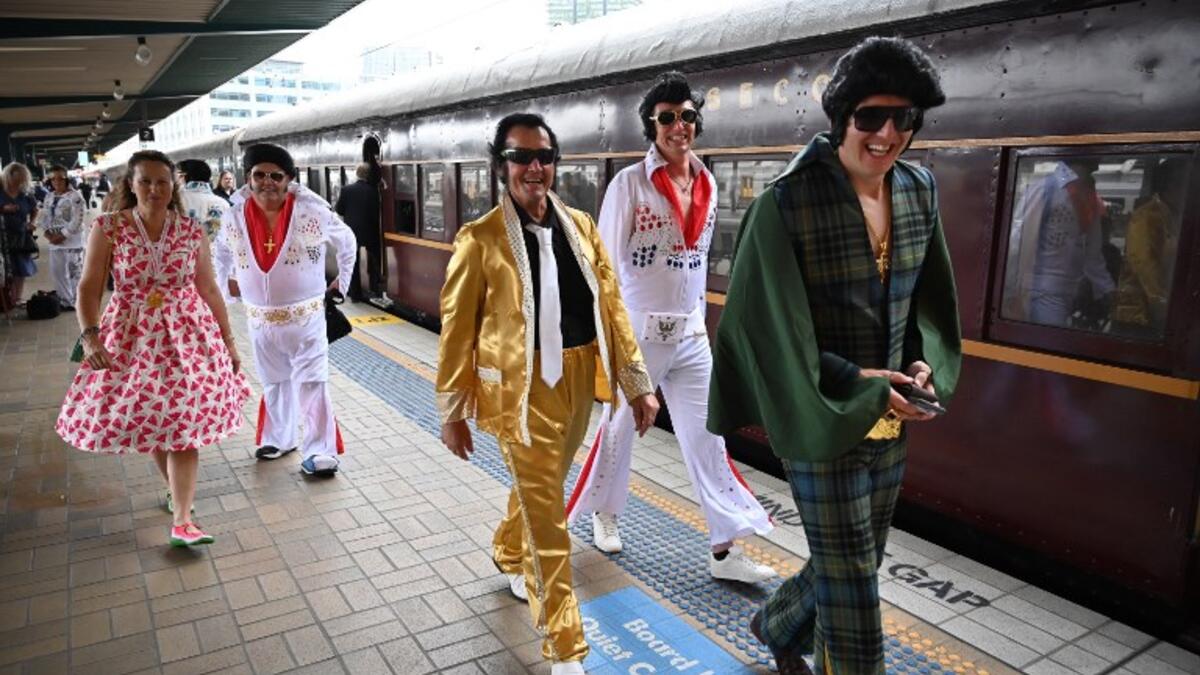 Elvis fans arrive at Central station before boarding a train to The Parkes Elvis Festival, in Sydney on January 10, 2019. The Parkes Elvis Festival is an annual event celebrating the music and life of Elvis Presley in the New South Wales town of Parkes.
PETER PARKS / AFP