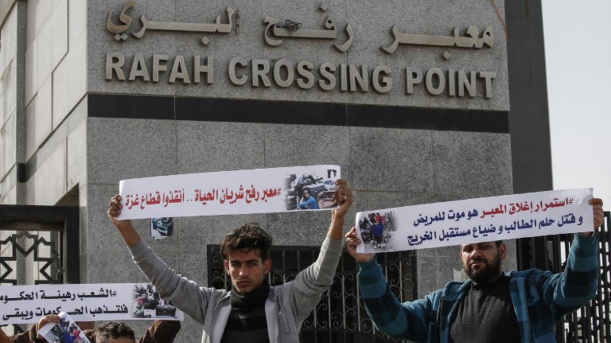 Palestinians protest against the closure of the Rafah crossing point between Egypt and the southern Gaza Strip and the Israeli blockade on the territory, on January 24, 2019 in Rafah. 
SAID KHATIB / AFP