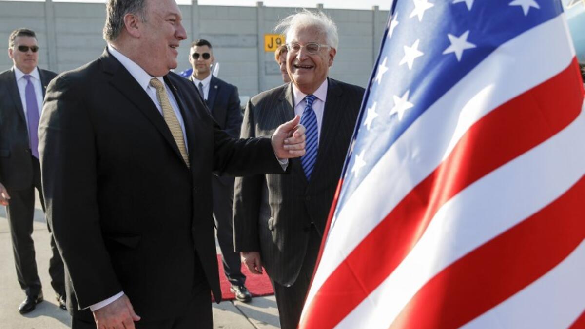 US Secretary of State Mike Pompeo (L) meets with US ambassador to Israel David Friedman (C) upon his arrival at Ben Gurion International Airport, near the Israeli city of Tel Aviv on March 20, 2019.
JIM YOUNG / POOL / AFP