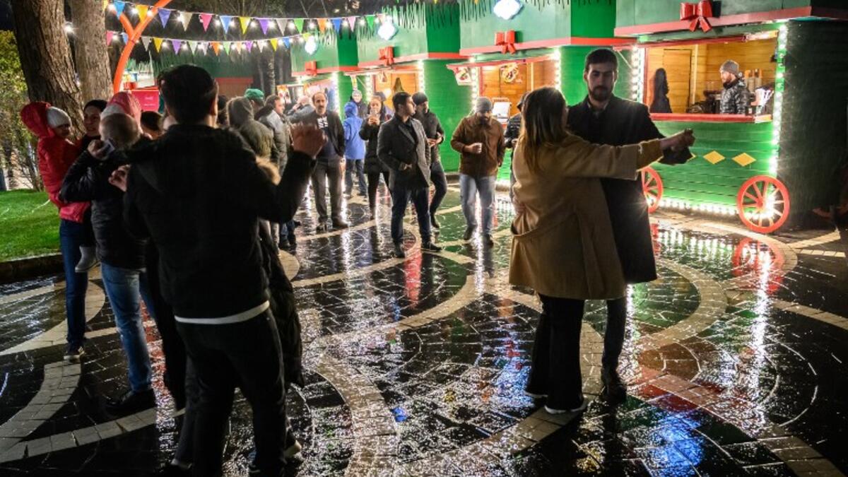 People dance at a Nowruz holiday market in Baku on March 20, 2019. Nowruz marks the first day of spring and the beginning of the year in the Persian calendar.
Mladen ANTONOV / AFP