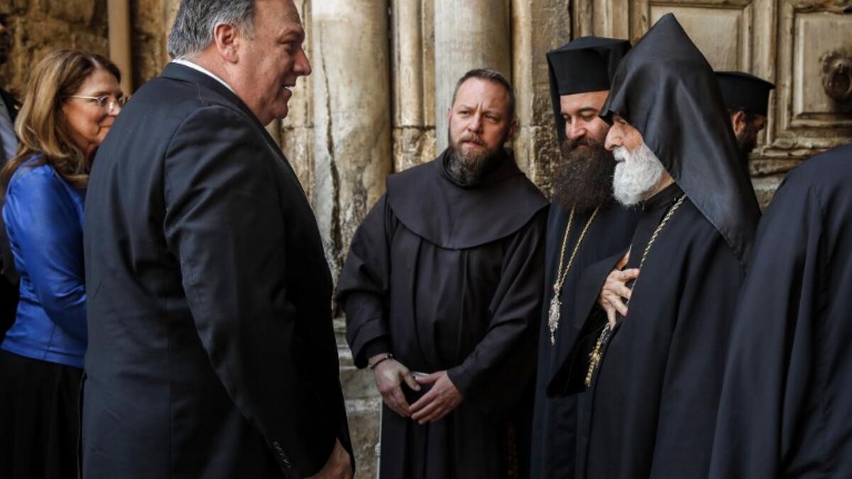 US Secretary of State Mike Pompeo (2nd-L) is greeted by Christian clergymen from various denominations as he visits the Church of the Holy Sepulchre in Jerusalem's Old City on March 21, 2019. 
JIM YOUNG / POOL / AFP