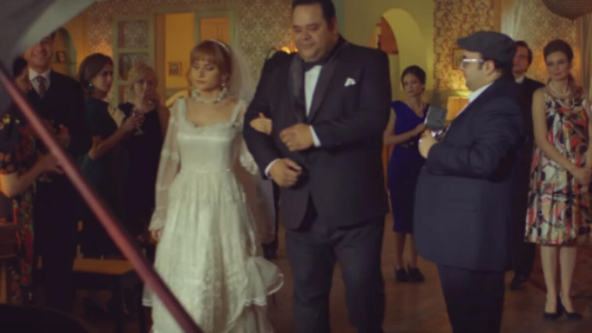 Egyptian Russian Actress Nelly Karim slipped into a wedding dress that suits the sixties which is the era