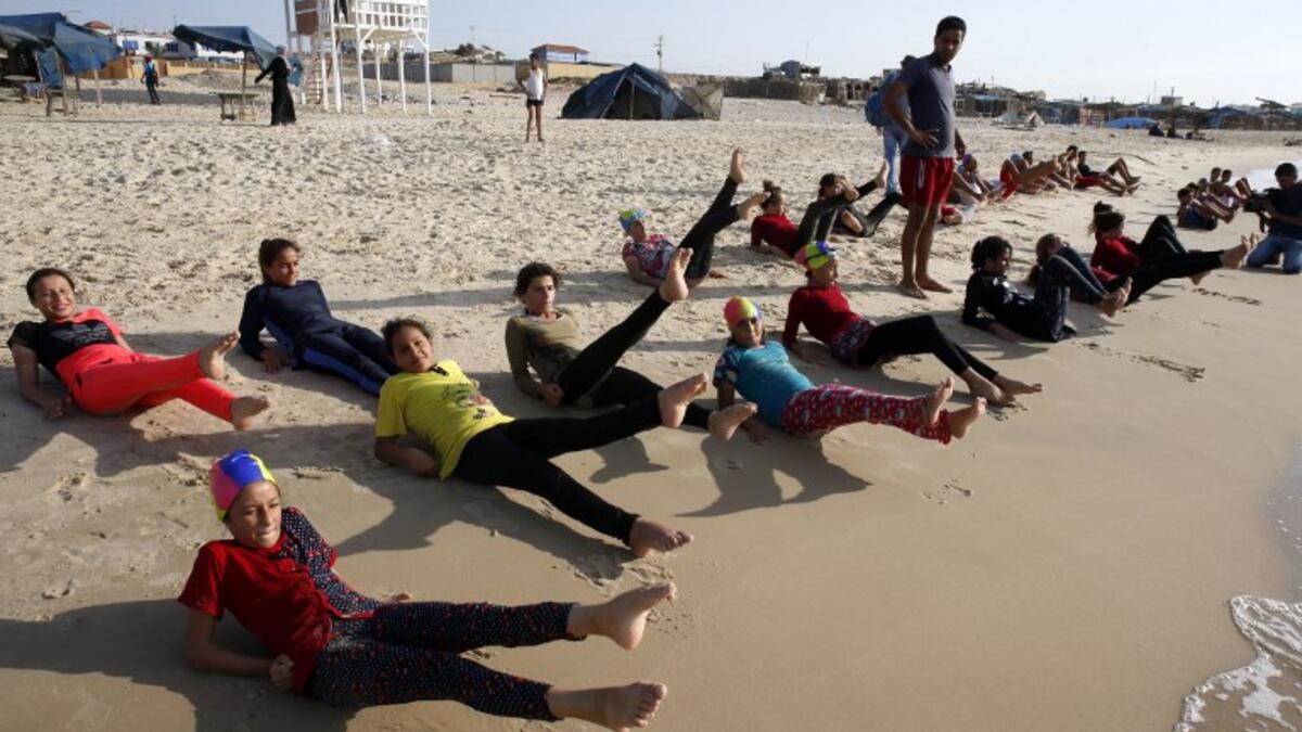 Young Palestinian members of a swimming club. (SAID KHATIB / AFP)