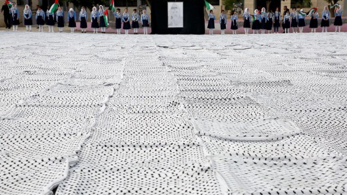 The largest Keffiyeh with a size of one thousand four hundred Meter square in dura. (HAZEM BADER / AFP)