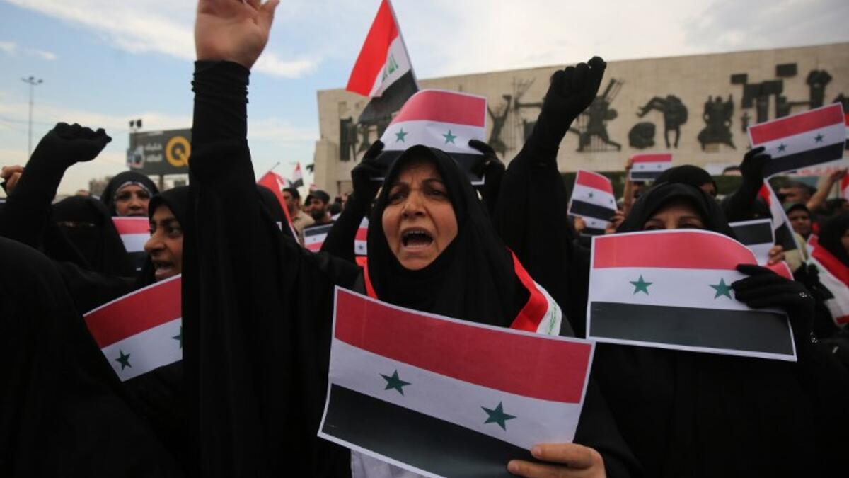 Women protestors in Baghdad’s Tahir Region on April 15, 2017 against western military strikes on Syria for the alleged chemical attacks on Douma, AHMAD AL-RUBAYE / AFP