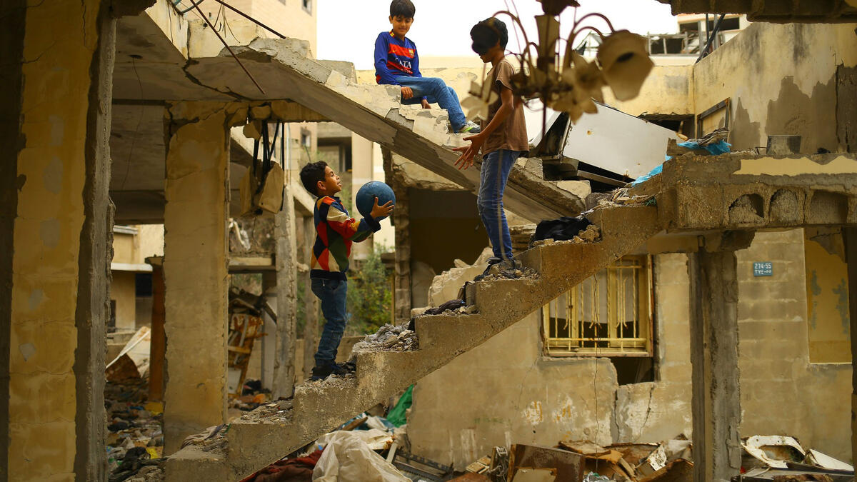 Playing in and with the ruins of war can be dangerous. Many children fall victim to unexploded ordnance rockets. Here Palestinian children play in a building destroyed during the 50-day war between Israel and Hamas militants in the summer of 2014 in Gaza City.