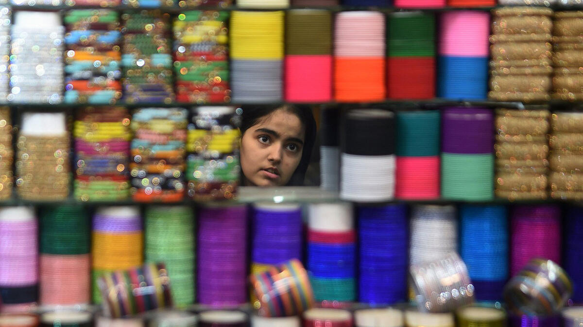 Wearing colorful bangles and putting on Henna during Eid is popular among women in Pakistan. Preparing the perfect outfit continues until the last moment. However, this year’s raising food prices have made it difficult for some to afford the extra expenses. Karachi on June 23, 2017.