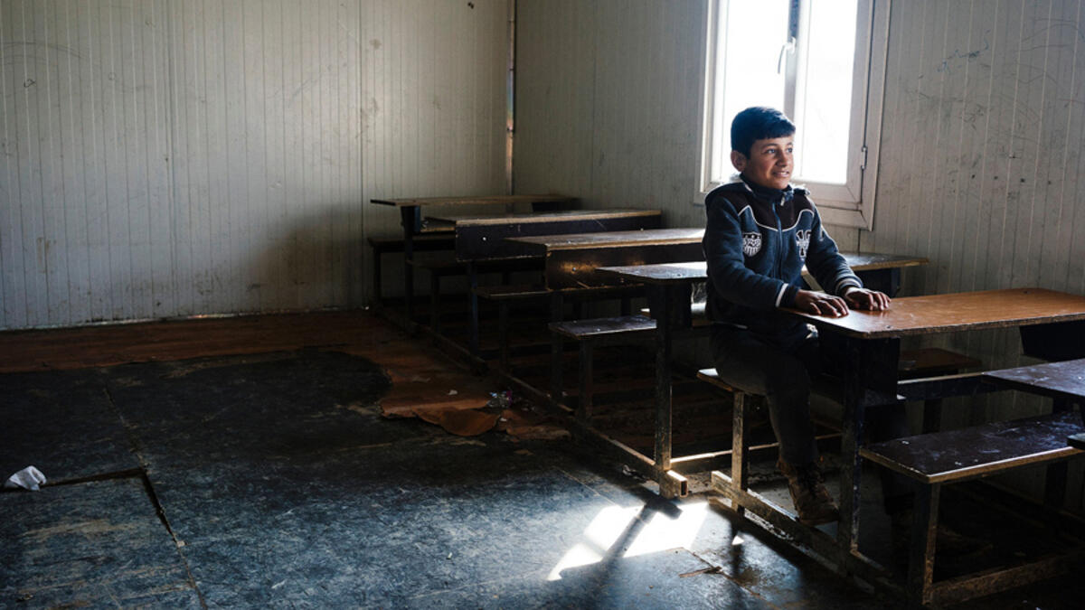 An Iraqi boy sits at a desk in a school in eastern Mosul. In January 2017, schools have started to re-open for the first time in three years. Under the control of Daesh, schools were either closed or followed the extremists’ group curricular. As a result, many children have been missing out on education during that time.