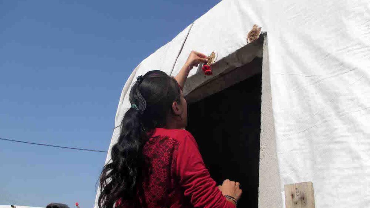 Broken egg shells, mud and anemone flowers are placed above the door of Yazidi homes, providing its residents with luck and fertility for the following year.