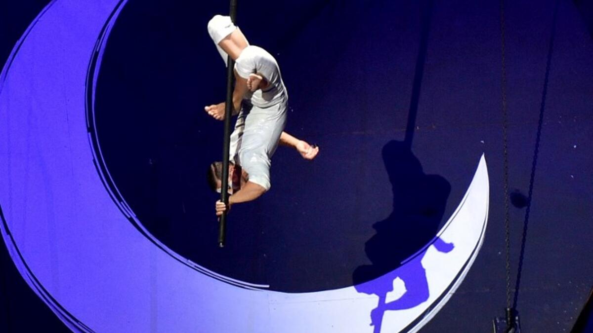 A member of the Canadian circus troop Le Cirque du Soleil performs a show as a part of celebrations of the 88th Saudi National Day at the King Fahad stadium on September 23, 2018 in Riyadh. (FAYEZ NURELDINE / AFP)