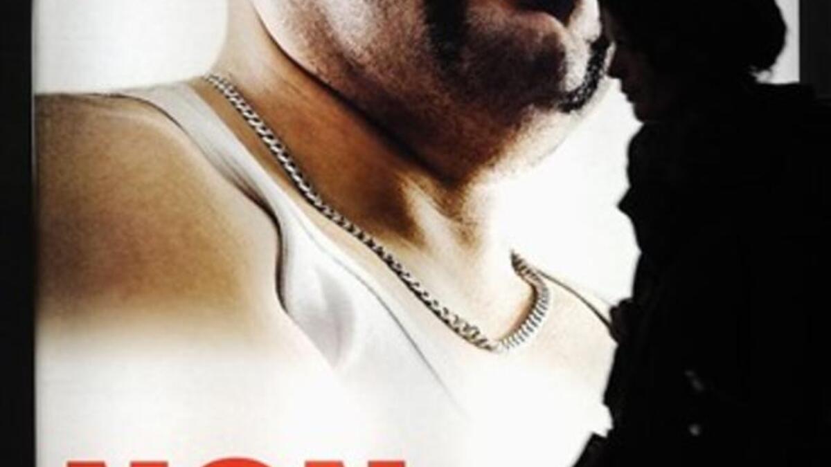 A woman walk past an election posters of the right-wing Swiss People's Party (SVP-UDC) reading "Ivan S. rapist and soon to be Swiss?" in Geneva.