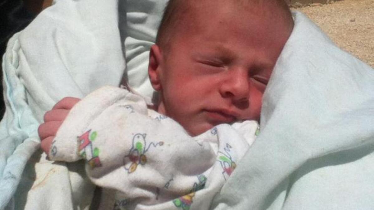 رضيع سوري في مخيمات اللجوء السورية