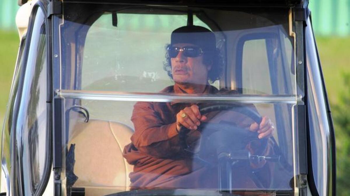 Gaddafi on the run, behind his 'shades'. His family fled to neighboring Algeria, welcomed as refugees,
according to desert nomadic tradition. Gaddafi's daughter, Aisha, gave birth to a girl on the Algerian borders. As for 
the current most wanted grandfather, he is playing Cat & Mouse with the NTC which is trying to cement its grip on Libya.