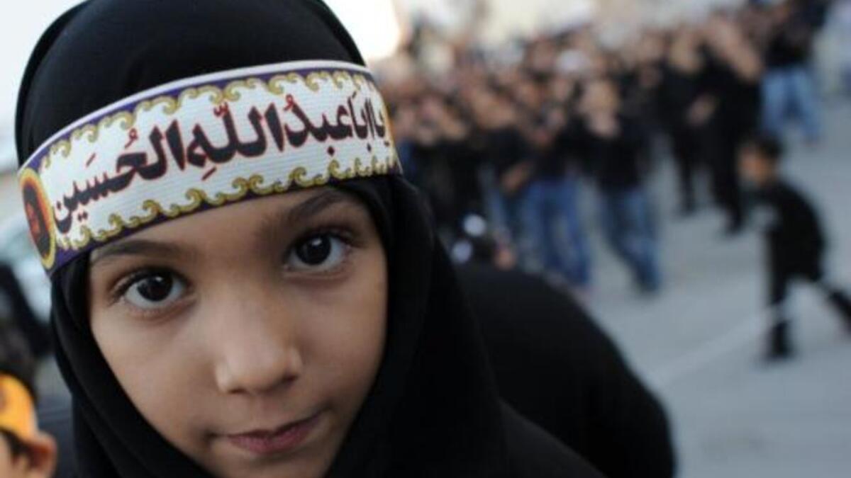 Ashura derives from 'tenth': It is a holy day for Islam marked on the 10th of 'Muharram', the first month of the Islamic lunar 
calendar. Muharram represents a period of mourning for a historical grievance in Shia Islam,
culminating Ashura. This child displays a classic lament for the revered martyr: 'O Hussein you were the father of Abdullah'.