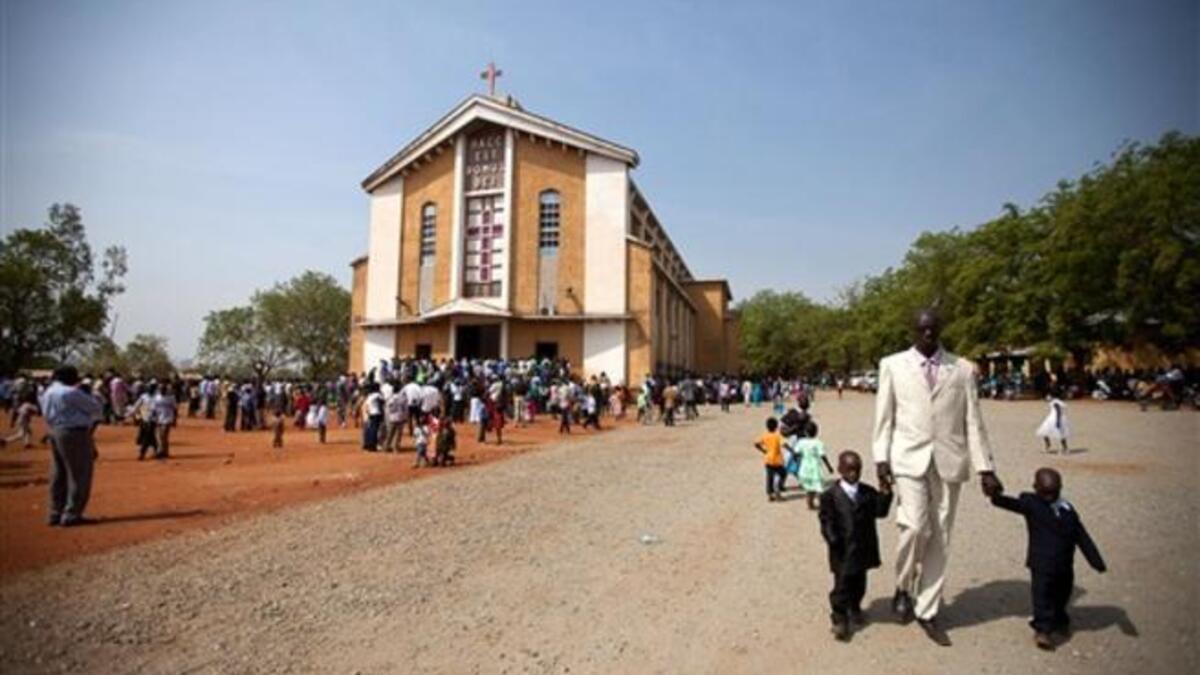 South Sudanese gather following the Christmas service at the Juba Catholic Cathedral, in the southern Sudan's capital city.