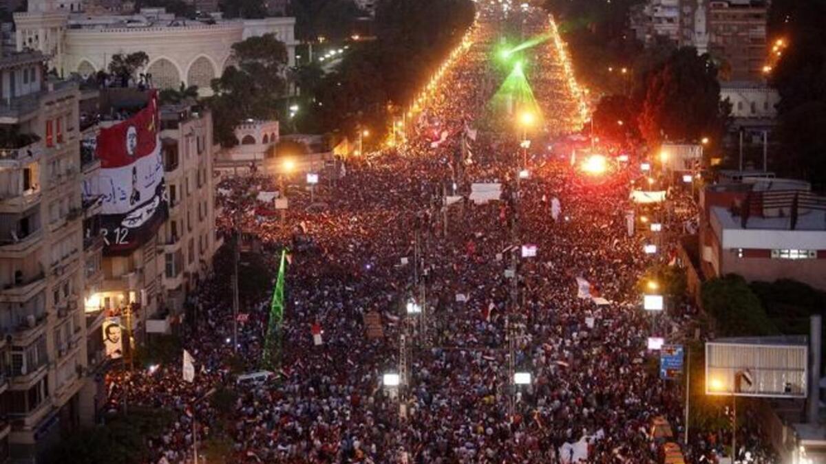 Hundreds of thousands of Egyptians flood the streets outside the presidential palace in Cairo (AFP)