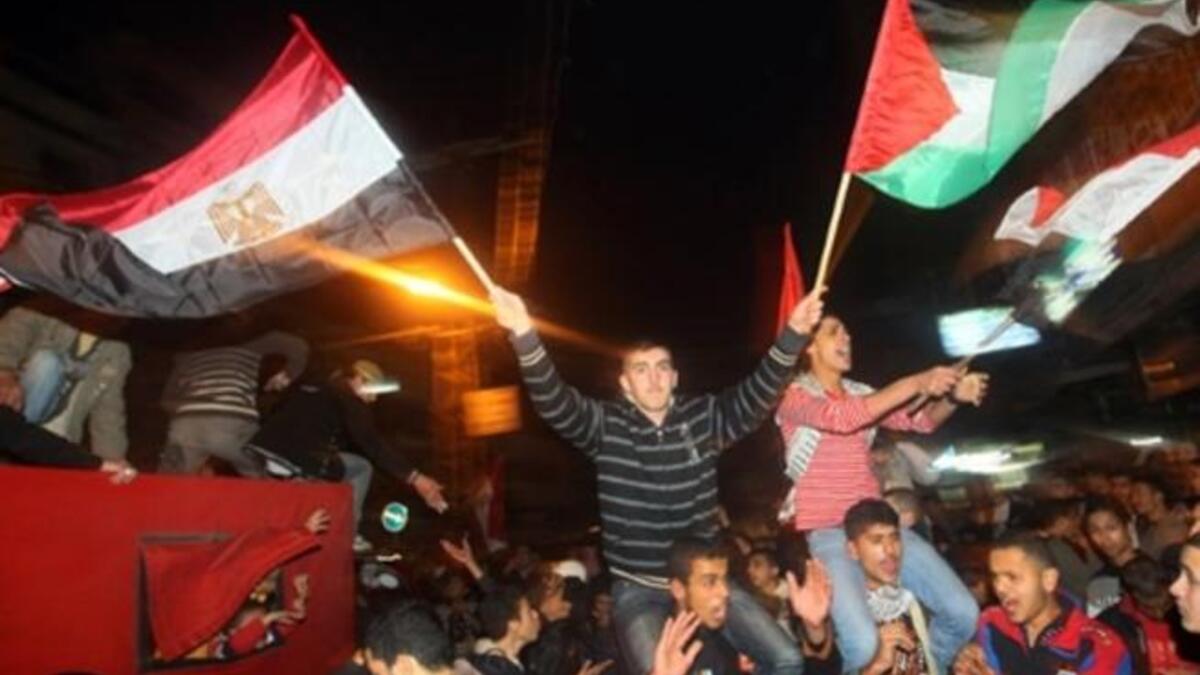 Palestinians in Gaza celebrate the victorious ousting of President Mubarak from power after a presidency that spanned three decades.