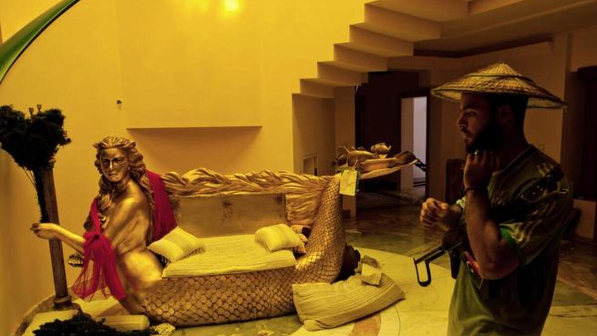 His Golden Child: Not just for her blond locks, but for her predilection for the gilded metal- a whole sofa's worth and a
"Rapunzel" amount
of hair in a vanity fashioned 'mermaid' furniture center-piece.