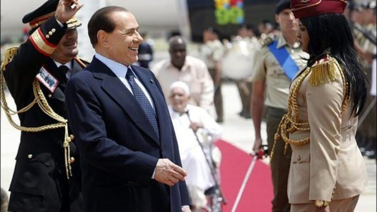 A warm relationship with Berlusconi means sharing  (female) staff resources or Guards? My Amazonian is your Amazonian. What’s mine is yours.