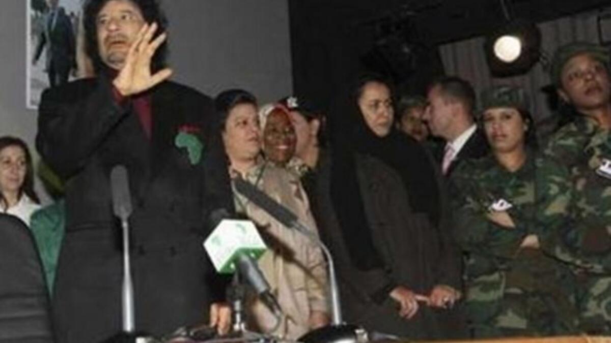 The renowned secretarial hand-picking by business men now translated into military standards. All of his girls are said to swear an oath that they will give their lives for him; they never leave his side, night or day.