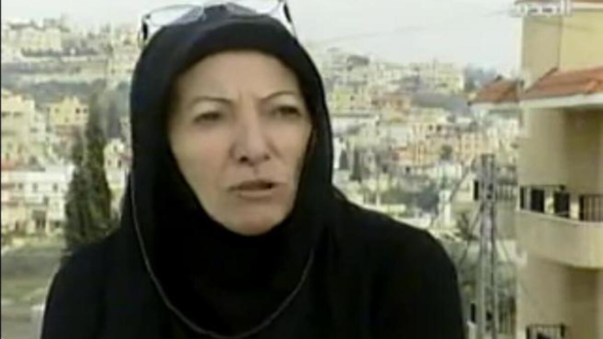 Die-hard loyal Lebanese lady no longer tows the Gaddafi line: Off duty now, this conservatively appareled woman
once served with Gaddafi's Premier Guard. The former sentry has spoken on her Colonel service and the 
atrocities witnessed. Azeza Ibrahim does not strike the image of the sultry exotic guards we expect of his select security 
unit.