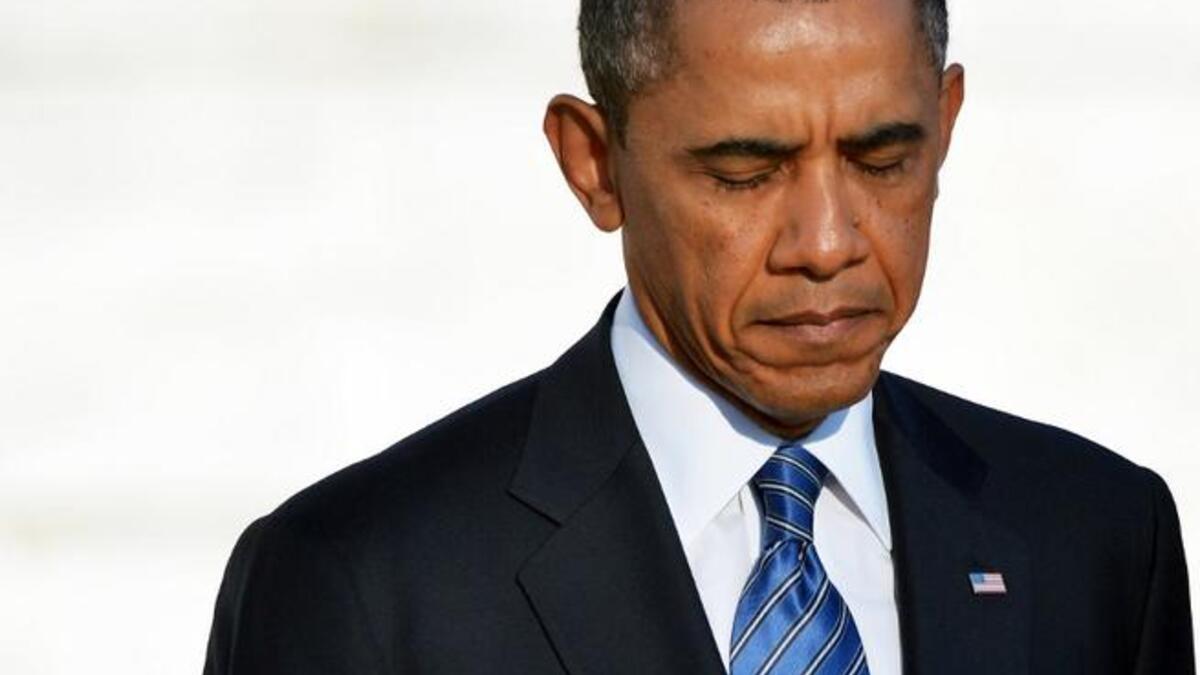 President Barack Obama feels the weight of the world