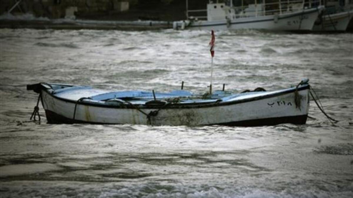 A fishing boat floats in wavy waters in the Lebanese ancient Mediterranean port of Byblos as heavy winds and rain whipped across Lebanon, grounding flights, knocking down billboards and causing nationwide traffic jams in the first winter storm to hit the country after months of drought.
