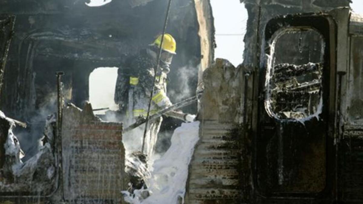Israeli fire fighters are still trying to extinguish the flames of a burning train wreck.