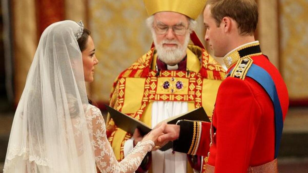 Still not a falter at the alter: And no wonder  when her Prince has just whispered the reassuring 'You look beautiful' as the Archbishop of Canterbury proceeds to 'marry' them, and pronounce them Man and Wife (in this case Duke and Duchess).