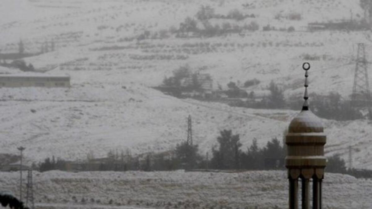 Snow covers the minaret of a mosque in Damascus as the Syrian capital was lashed by a snowstorm which disrupted traffic but brought some relief from a drought which has gripped the country for the past four years.