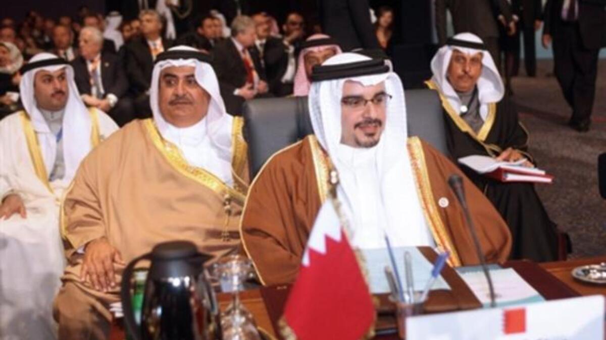 Crown Prince of Bahrain Sheikh Salman bin Hamad al-Khalifa (front) and Foreign Minister Sheikh Khalid bin Ahmed Al-Khalifa (2nd L).