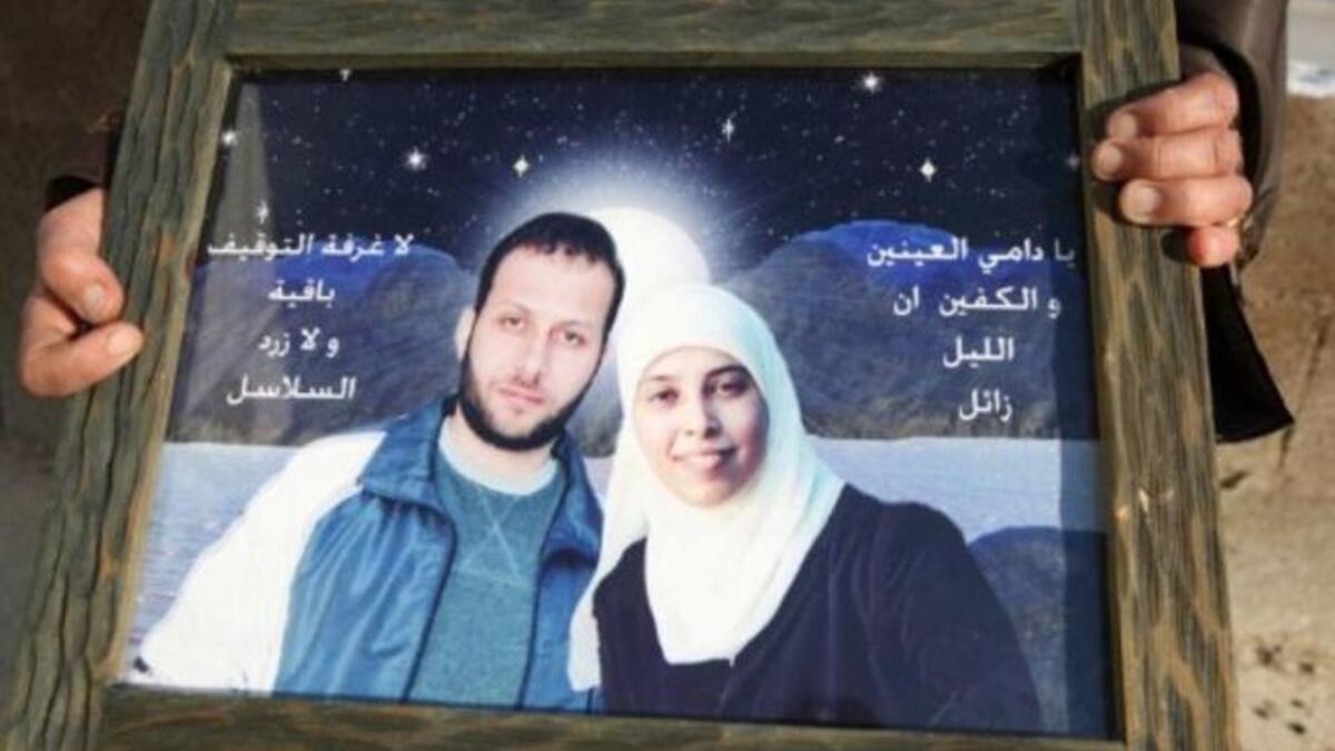 Love jail-birds: Ahlam got engaged to Nizar in prison but they never thought they'd get out to seal the deal.
Now both free, they plan to start a married life together. The only obstacle to their tale (they've already overcome a few,  
like prison and being from Hamas & Fatah respectively) is one's release into the West Bank, the other's Jordan.