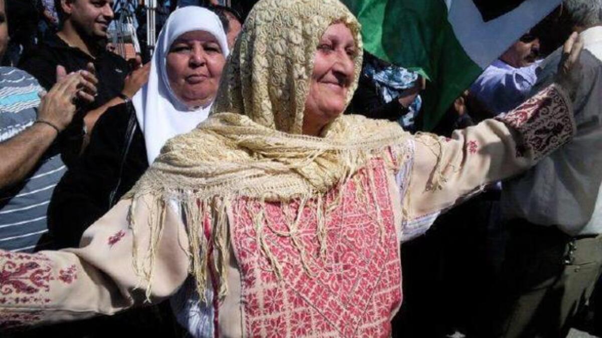 'Every-prisoner's Mom': This Palestinian lady , Um Mahmoud reveling in the imminent release was asked who
 she was dancing and singing in honor of. She answered that she had no particular release to celebrate but regarded the
 prisoners all as her children. Other cases included: a married, pregnant daughter meeting the father she never knew.