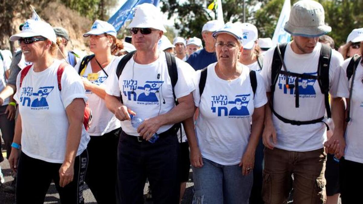 Every Israeli's boy comes home: Jubilant Israeli home crowds celebrated their collective victory in securing their 
kidnapped 'cub' soldier back to their fold. Father of hostage Shilat was not alone in celebrating the return of his son as the nation
christened Gilad 'everyman's son'. Throngs sang songs, waved Israeli flags, and popped champagne.