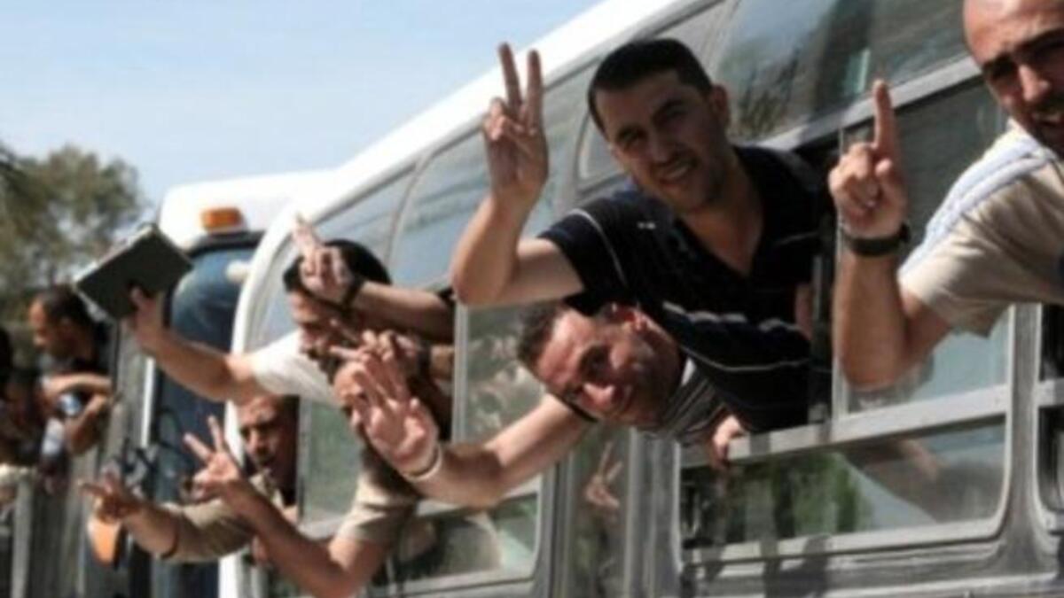 The Palestinian prisoner homecoming was happy news for many families. Many heard that the prisoners were
free from the mosque loudspeakers first: Mothers fainted or ululated. No joy for one brother agonizing over how he would break the
news to his mother that her son,18 years into a life sentence for killing Israeli soldiers, was not on the bus.