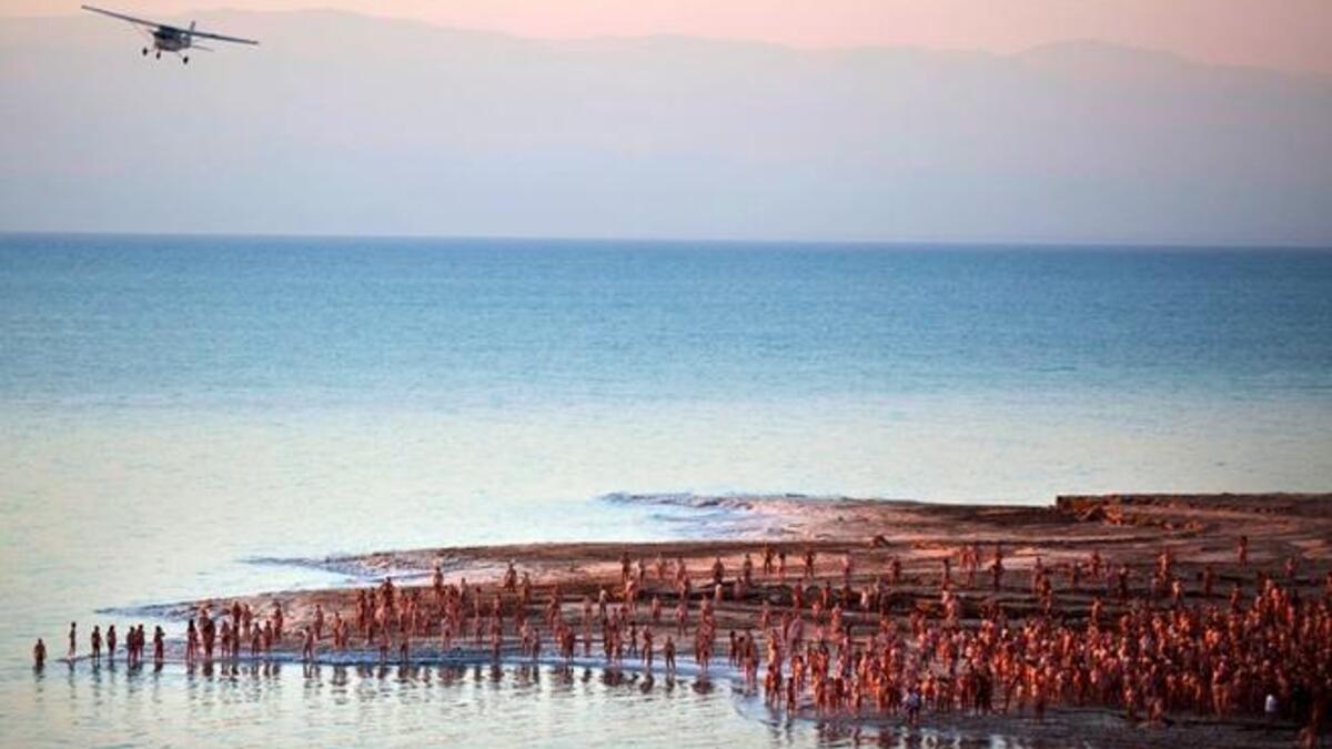 Has the exemplar of the chosen faith, Israel, fallen from grace? If Sharon surfaced, he'd learn of the 'depravity' of his 
compatriots who recently got naked in the name of (Holy Land) art. Much to the dismay of the religious right, a 'tribe' of 1,000 chosen
Israelis took part in Spencer Tunick's mass nude shoot in the Dead Sea.