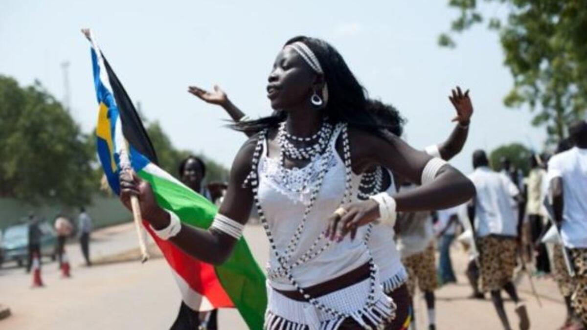 Women from a cultural dance troupe parade through Juba.