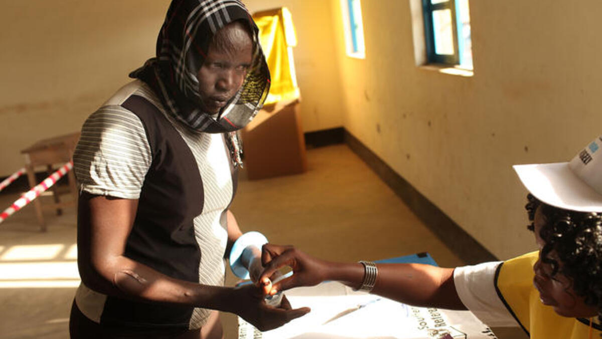 A woman votes during the first day of voting for the independence referendum.