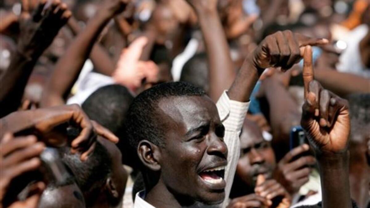 A Sudanese student shouts slogans during a protest against the visit of Darfur mediators from Qatar and the UN outside the University of Zalingei.
