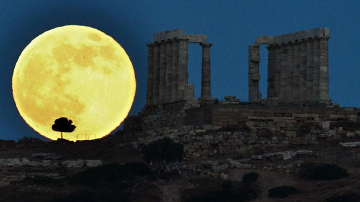 Supermoon next to ruins in Greece.
