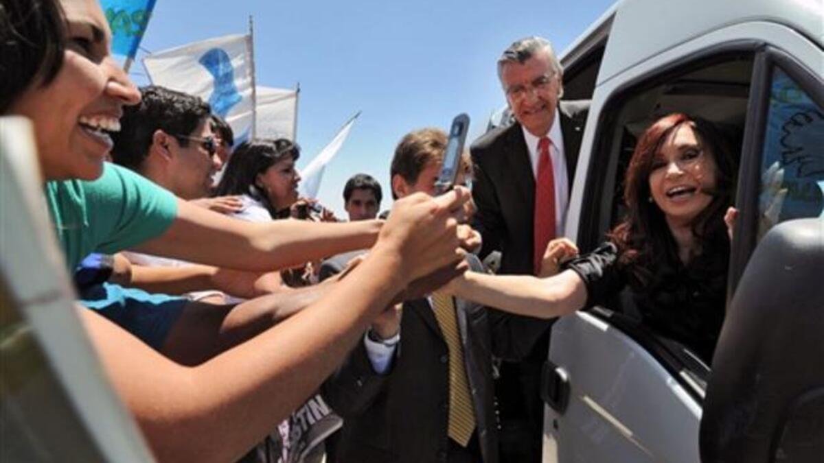 P.Cristina Kirchner greeting supporters during the inauguration of the school "President Nestor Kirchner" next to San Juan province Governor, Jose Luis Gioja. Argentine diplomats pointed out the seriousness of the US documents offending President Cristina Kirchner which were released by Wikileaks.