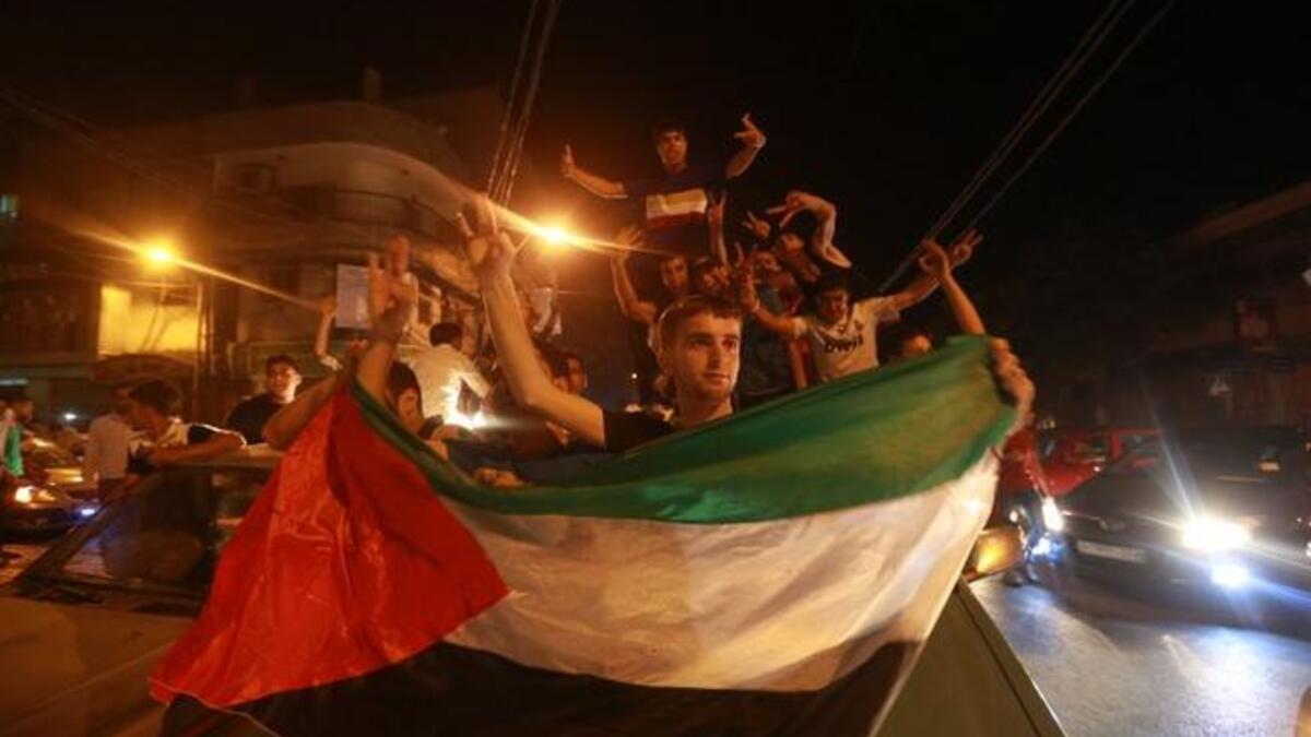 فلسطينيون يحتفلون بفوز عساف في عرب أيدول