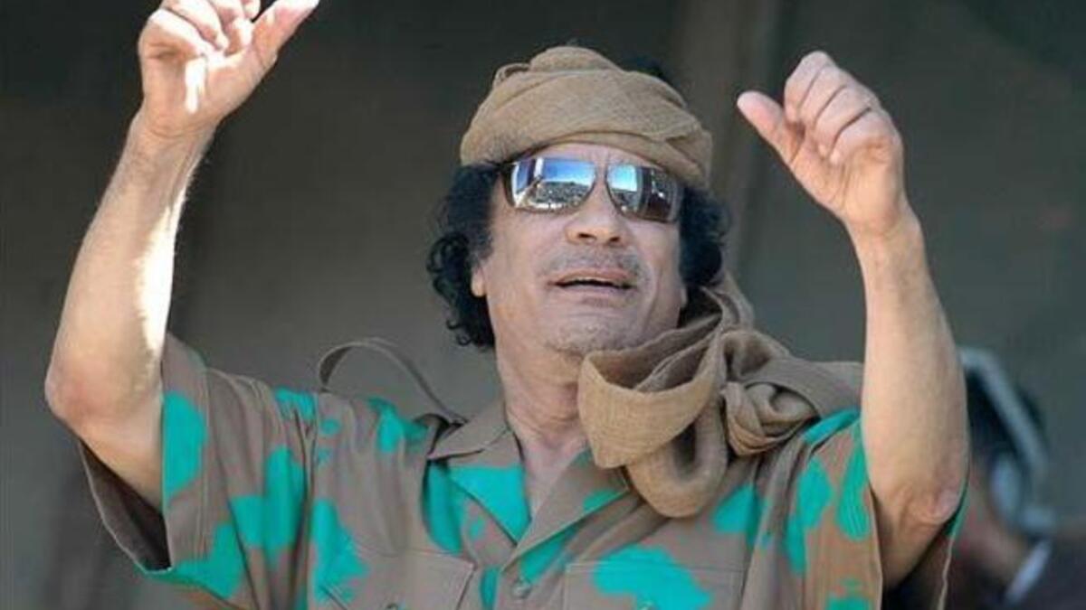 Flamboyant outfits to match the political mood or fancy: Here he sports a tye-dyed Africa mapped shirt reminding us that he is a proud Head of the African Union.