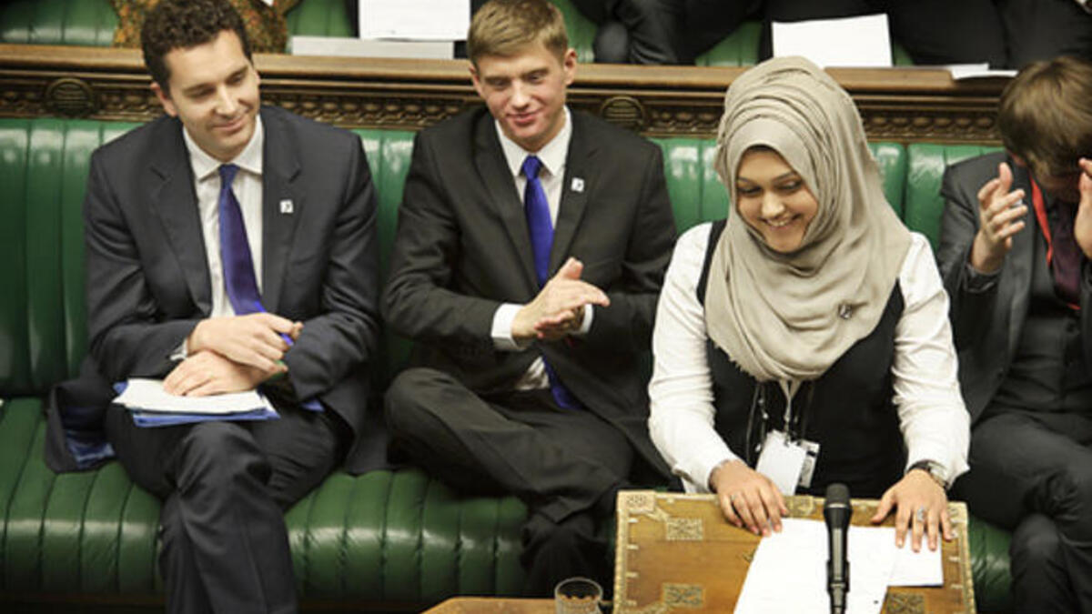 Sumaiya Karim grins in parliament