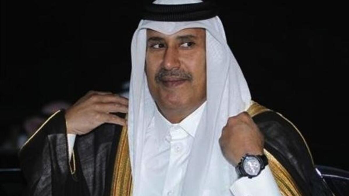 Qatari Prime Minister Sheikh Jassim bin Jaber Al Thani cozies up to the women